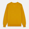 View 3 of product The Gold Paden Cashmere V-Neck Jumper by Turnbull & Asser features a bright yellow hue, long sleeves, ribbed cuffs and hem, and a classic design. It is shown laid flat on a white background.