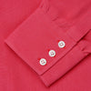 View 4 of product The Turnbull & Asser Coral Pink Silk Regular Fit Mayfair Shirt features long sleeves, a classic collar, and white buttons, displayed laid flat on a plain white background.