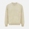 View 1 of product The Turnbull & Asser Ivory Cashmere V-Neck Jumper, with long sleeves and ribbed cuffs and hem, is shown against a plain white background.