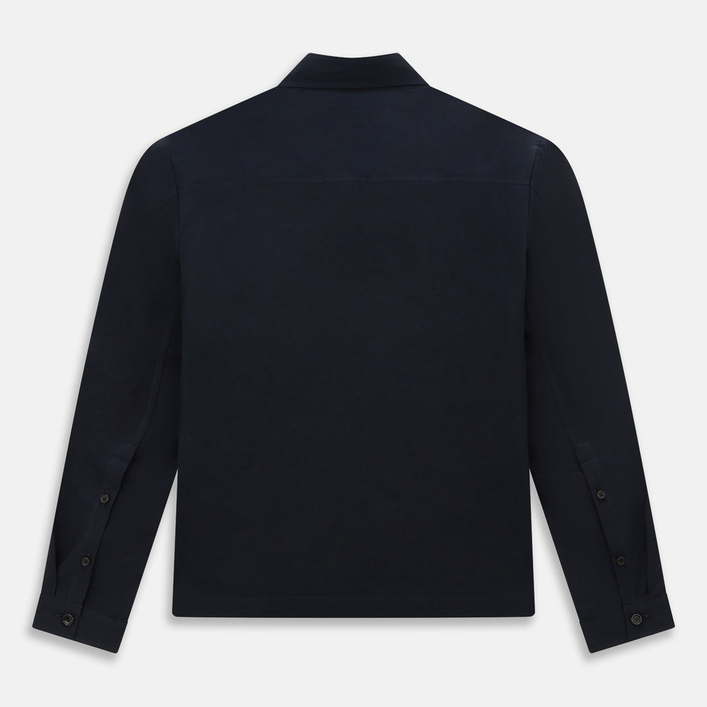 The Midnight Blue Hyde Overshirt by Turnbull & Asser is a plain, long-sleeve shirt in dark navy sanforised cotton with a single chest pocket, spread collar, and black buttons, shown laid flat on a white background.