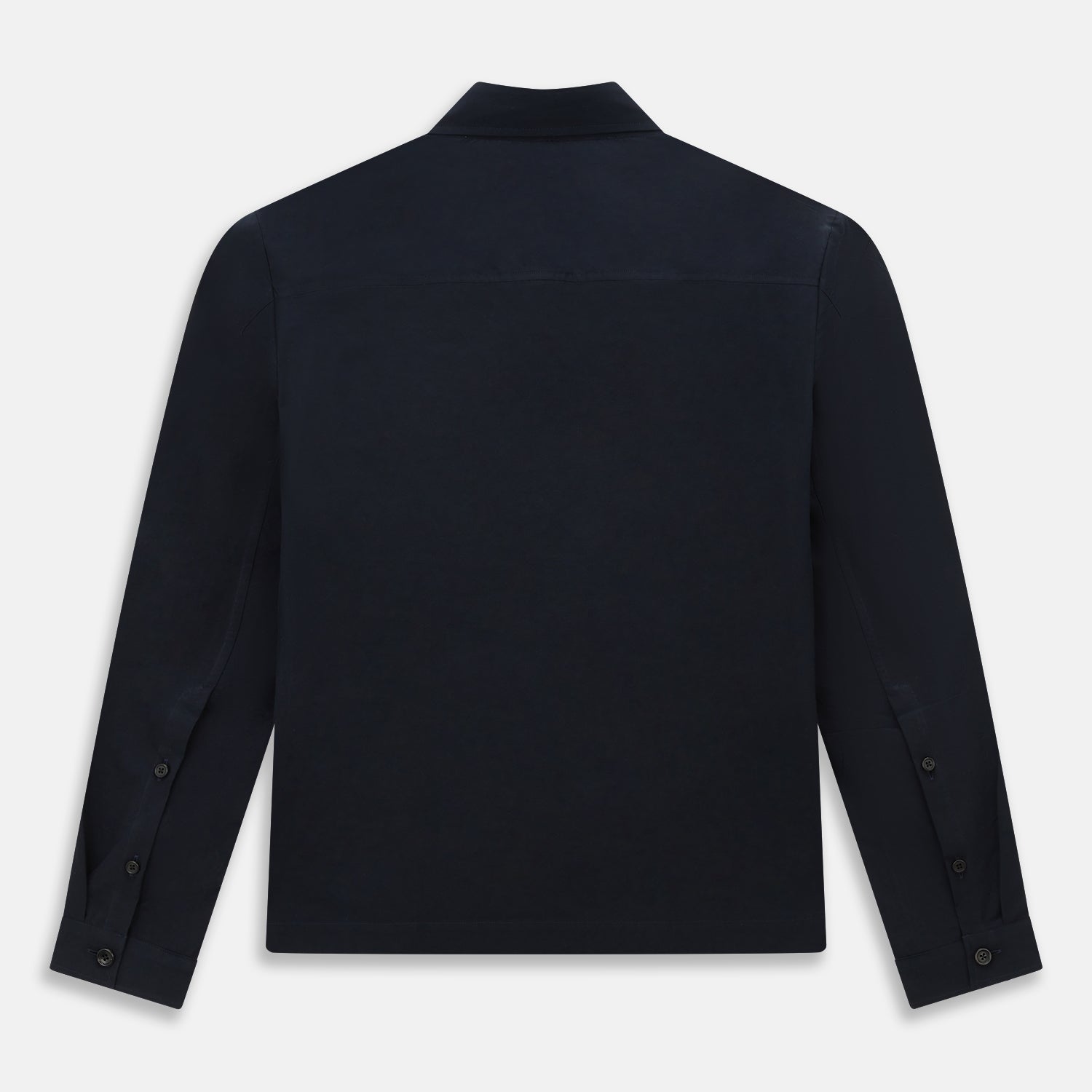 View 3 of product The Midnight Blue Hyde Overshirt by Turnbull & Asser is a plain, long-sleeve shirt in dark navy sanforised cotton with a single chest pocket, spread collar, and black buttons, shown laid flat on a white background.
