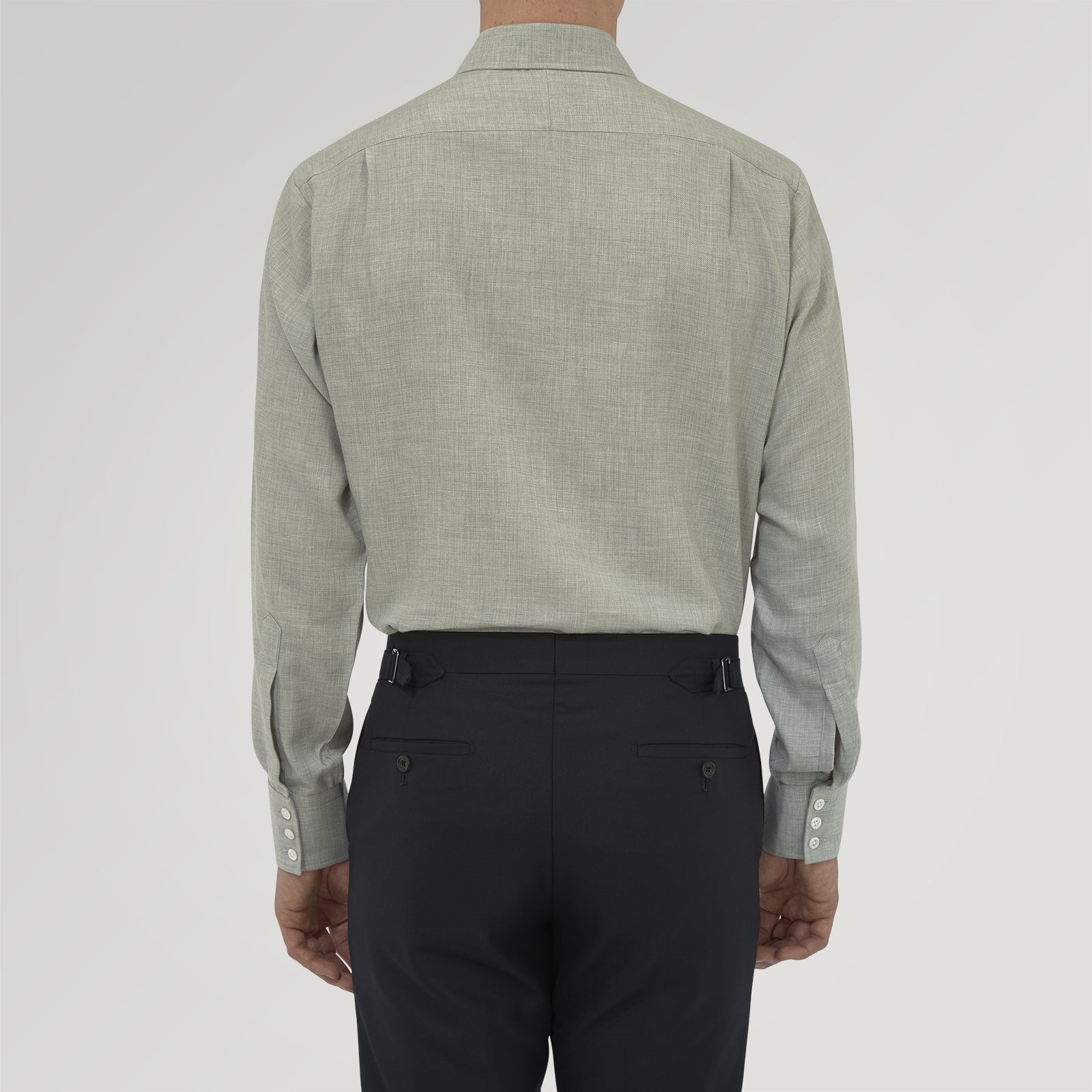 View 3 of product The Turnbull & Asser Grey Cashmere Blend Shirt features a T&A collar, 3-button cuffs, and a front pocket, shown neatly folded with white buttons against a plain white background.