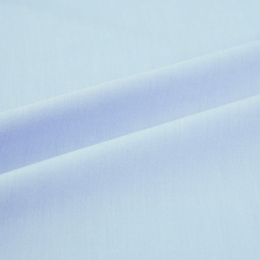 The Turnbull & Asser Sky Blue Mayfair Shirt is a long-sleeved, collared button-down made from sanforised cotton, shown laid flat on a white background.