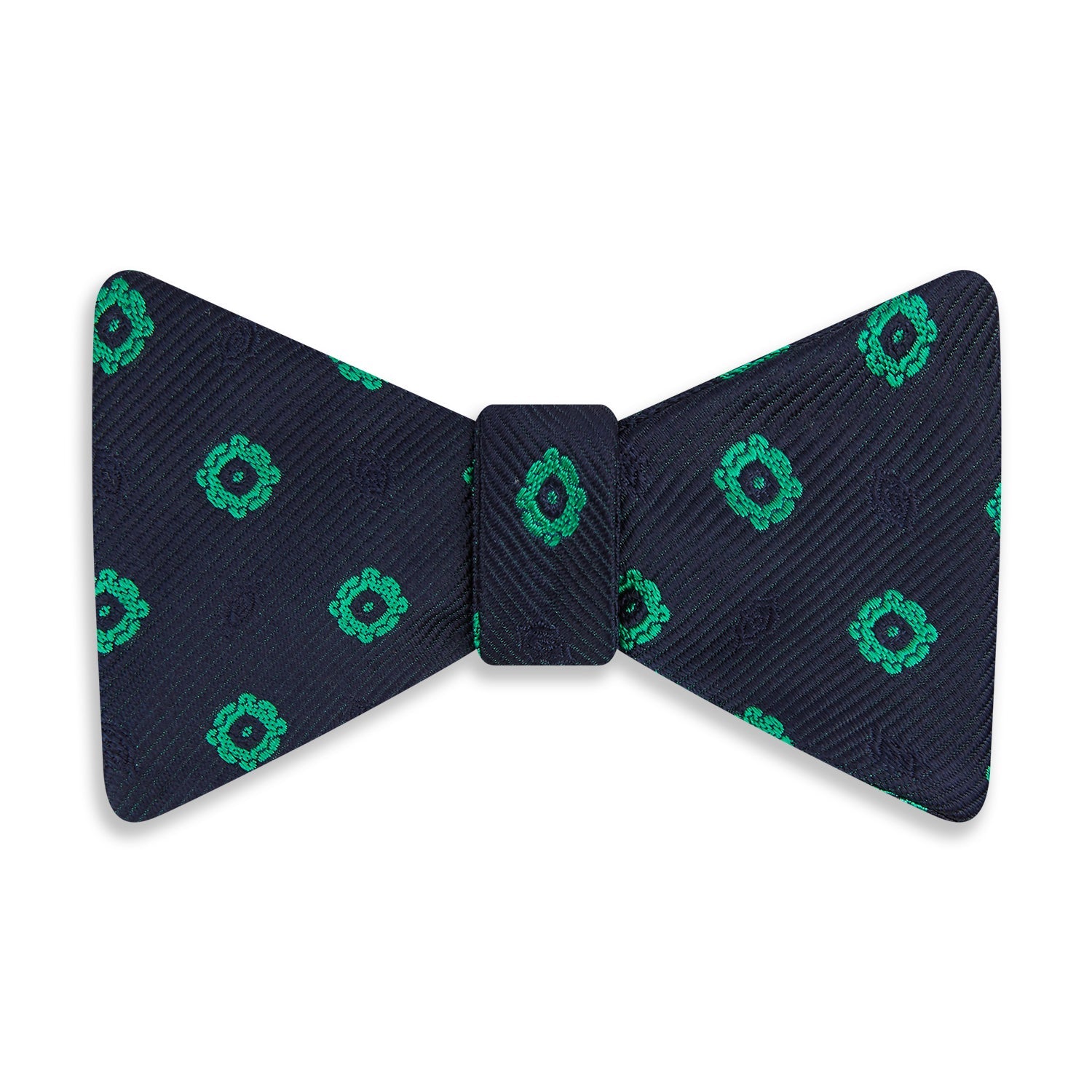 View 1 of product The Navy and Green Motif Silk Bow Tie by Turnbull & Asser features geometric floral patterns, ideal for formalwear, and is shown on a white background.