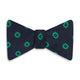 The Navy and Green Motif Silk Bow Tie by Turnbull & Asser features geometric floral patterns, ideal for formalwear, and is shown on a white background.
