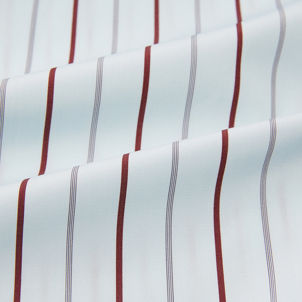 The Turnbull & Asser Burgundy Combination Stripe Mayfair Shirt features long sleeves, a classic T&A collar, and vertical black and burgundy stripes on white, laid flat against a plain white background.