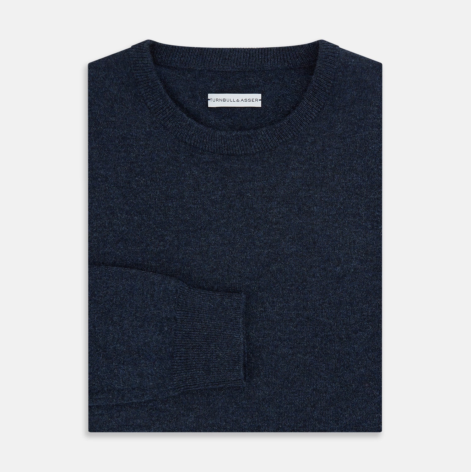 View 4 of product The Turnbull & Asser Midnight Blue Cashmere Round Neck Jumper, featuring long sleeves and ribbed trims, is shown against a light grey background.