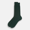 View 2 of product Turnbull & Asser's Olive Mid-Length Socks, crafted from mercerised Egyptian cotton in dark green with ribbed detailing, are displayed against a plain white background, showcasing refined comfort and enduring style.
