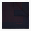 View 1 of product The Turnbull & Asser Navy and Burgundy Stripe Silk Pocket Square features diagonal stripes in one corner, hand-rolled edges, and "TURNBULL & ASSER HAND PRINTED IN ENGLAND" printed in red on luxurious silk.