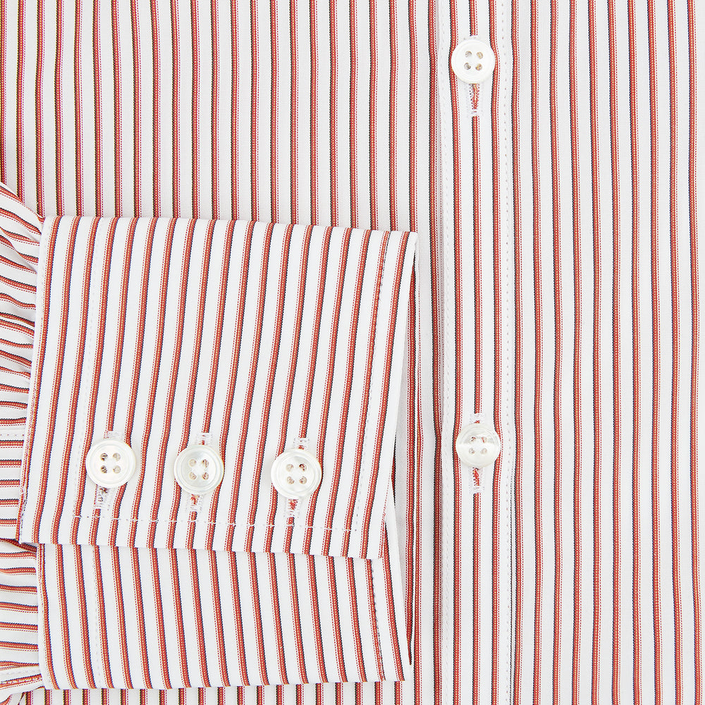 The Red Shadow Stripe Westminster Shirt by Turnbull & Asser features long sleeves, a Turnbull collar, thin red and white vertical stripes, white buttons, and showcases British craftsmanship against a plain white background.