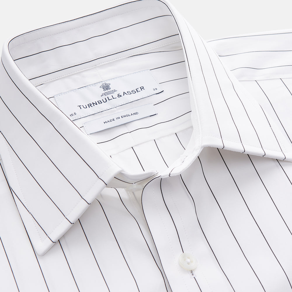 The Turnbull & Asser Black Fine Stripe Cotton Regular Fit Mayfair Shirt features a T&A collar, buttoned cuffs, and black fine stripes, displayed flat on a white background.