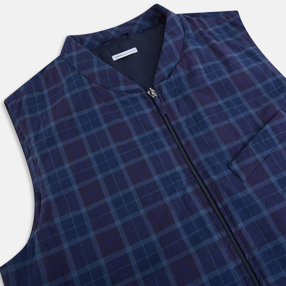 The Turnbull & Asser Navy and Purple Plaid Check Padded Gilet is sleeveless, has a front zipper, two zippered side pockets, a small chest pocket, and is shown on a plain white background.
