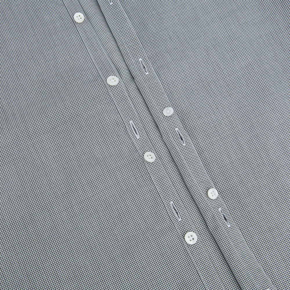 The Turnbull & Asser Grey and White Micro Check Westminster Shirt features long sleeves, a button-up front, a Westminster collar, and white buttons, shown flat on a white background.