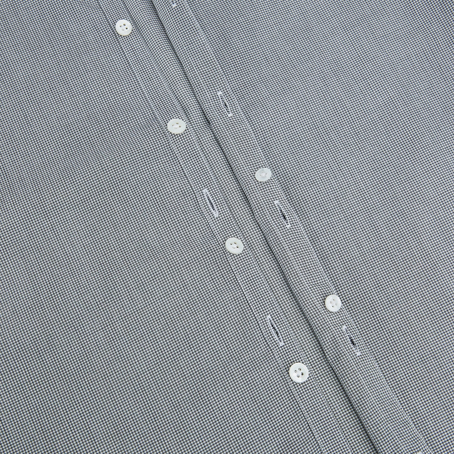 View 6 of product The Turnbull & Asser Grey and White Micro Check Westminster Shirt features long sleeves, a button-up front, a Westminster collar, and white buttons, shown flat on a white background.