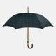 The Turnbull & Asser Black Watch Tartan Traveller Umbrella features a Malacca crook handle and a dark green and navy blue plaid canopy, shown against a plain white background.