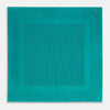 View 4 of product The Turnbull & Asser Petrol Green Dot Silk Pocket Square, made in England, features a border and small black polka dots, neatly folded to showcase both front and back sides.