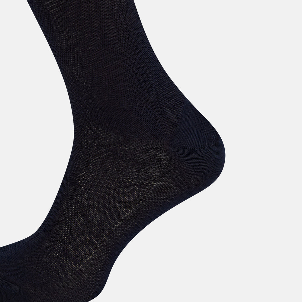 A single Turnbull & Asser Navy Micro Knit Long Sock is shown in a side profile against a plain white background, with the toe pointing downward and the cuff at the top.