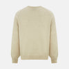 View 3 of product The Turnbull & Asser Ivory Cashmere V-Neck Jumper, with long sleeves and ribbed cuffs and hem, is shown against a plain white background.