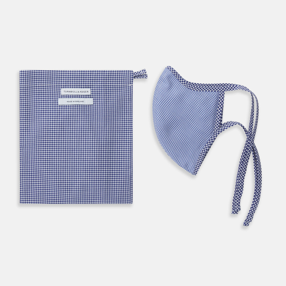The Turnbull & Asser White & Navy Multi Check Commuter Mask comes with 3 Viroformula™ filters and two adjustable tie straps on each side, shown on a plain white background.
