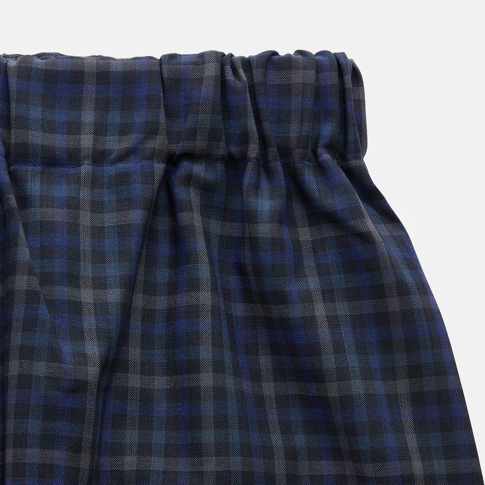 Turnbull & Asser’s Blue Multi Check Wool Hasting Pyjama Trousers, featuring an elastic waistband, are laid flat on a white background.