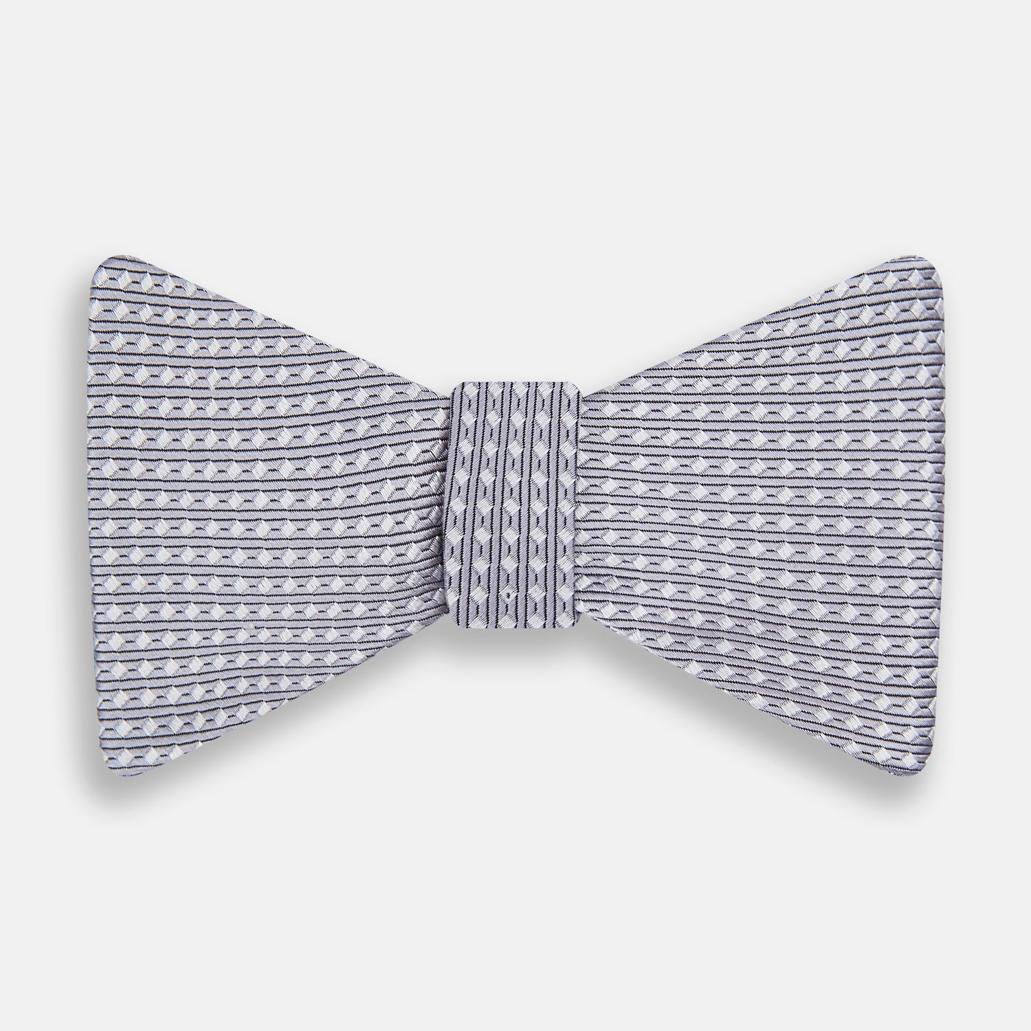 View 1 of product The Turnbull & Asser Silver and White Square Silk Bow Tie features a subtle geometric pattern, ideal for formalwear, and is displayed against a plain white background.