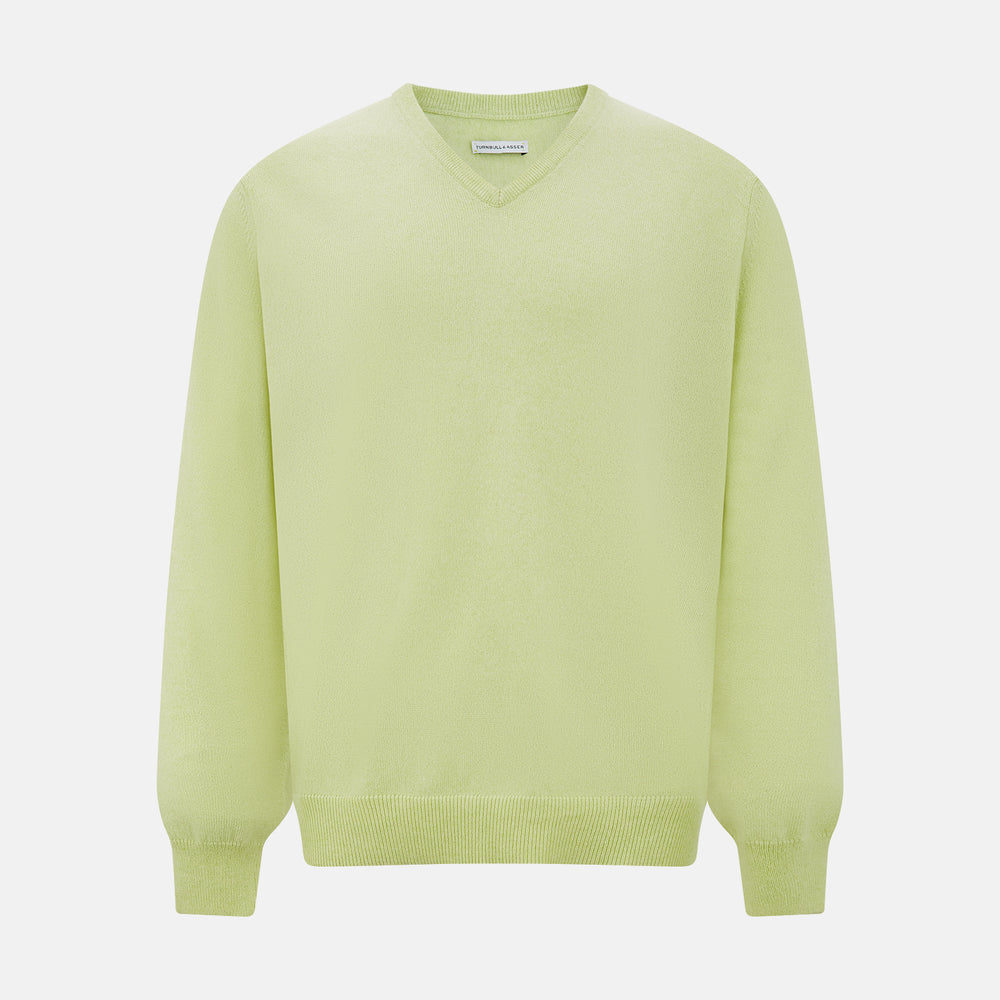 The Turnbull & Asser Pistachio Cashmere V-neck Jumper features long sleeves, ribbed cuffs and hem. Shown in light green against a white background, it's a classic addition to any knitwear collection.