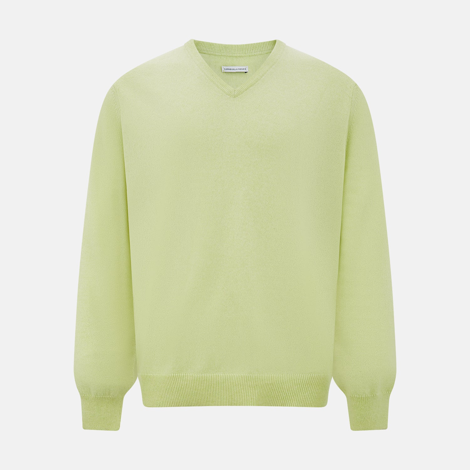 View 1 of product The Turnbull & Asser Pistachio Cashmere V-neck Jumper features long sleeves, ribbed cuffs and hem. Shown in light green against a white background, it's a classic addition to any knitwear collection.