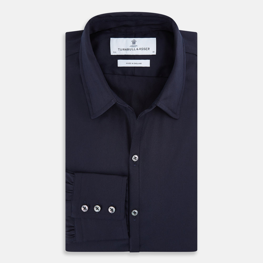 The Navy Twill Windsor Shirt by Turnbull & Asser features long sleeves, a button-up front, British craftsmanship, and a refined Windsor collar, shown in dark navy on a plain white background.