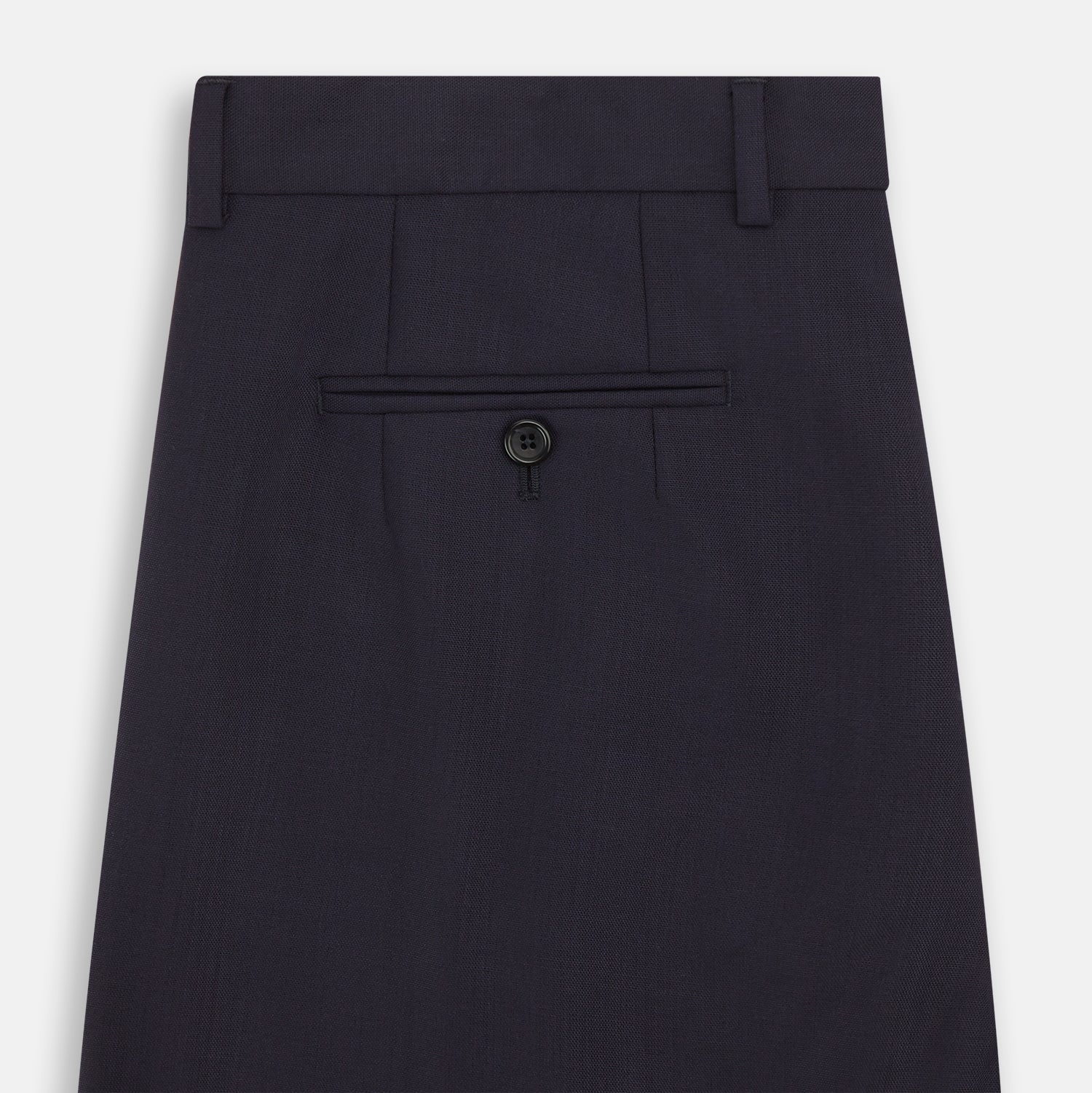 View 5 of product The Navy Rupert Trousers by Turnbull & Asser are tailored wool trousers with a button and zip closure, belt loops, and front creases, elegantly displayed against a plain white background.