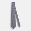 View 2 of product The Turnbull & Asser Navy and Pink Weave Patterned Silk Tie is shown elegantly rolled up on a white background.