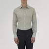 View 2 of product The Turnbull & Asser Grey Cashmere Blend Shirt features a T&A collar, 3-button cuffs, and a front pocket, shown neatly folded with white buttons against a plain white background.