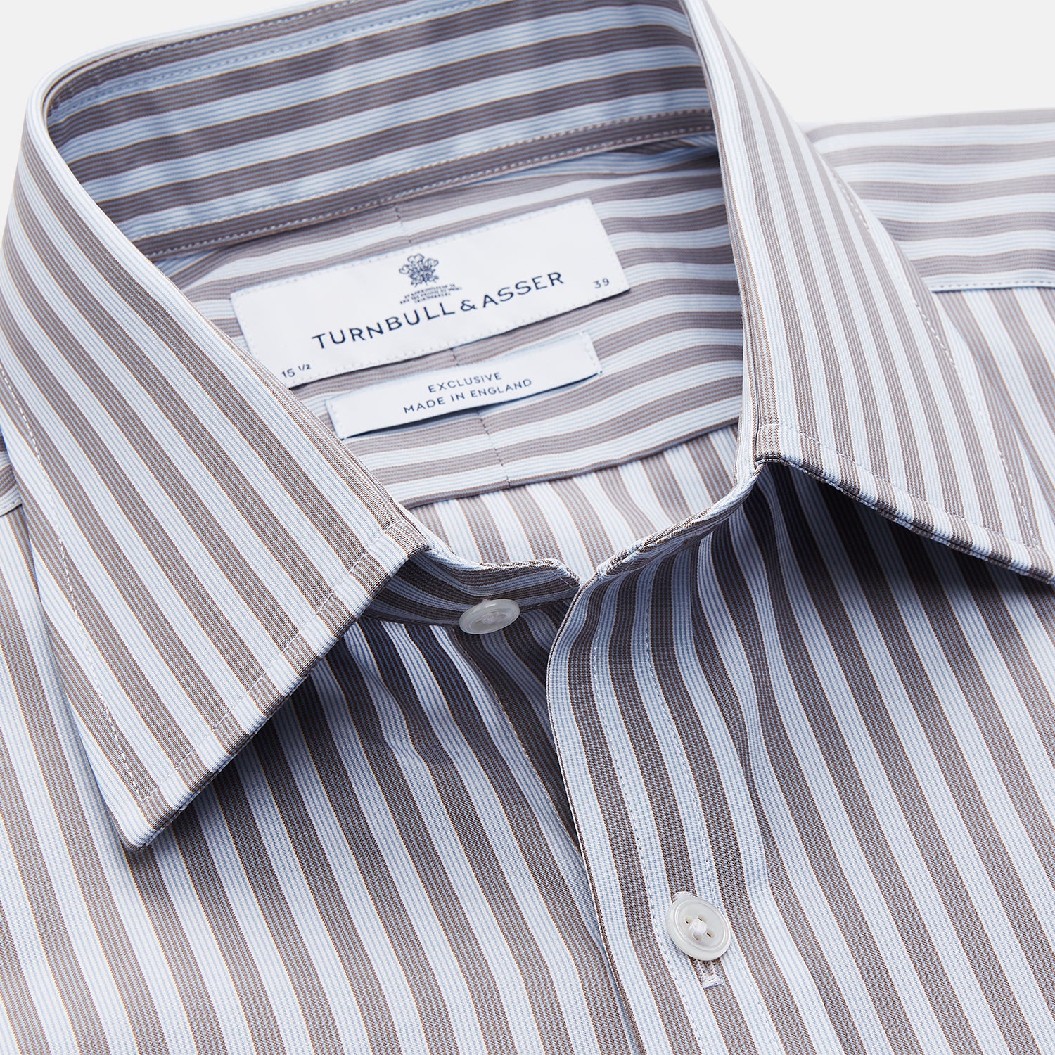 View 2 of product The Turnbull & Asser Pale Blue Multi Stripe Cotton Regular Fit Mayfair Shirt features long sleeves, a pointed collar, buttoned cuffs, and vertical stripes in pale blue tones, displayed against a white background.