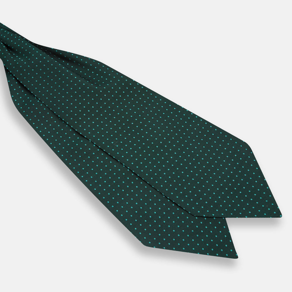 The Turnbull & Asser Blue and Forest Green Micro Dot Silk Cravat pairs perfectly with a dark green pocket square featuring light blue micro dots, ideal for formal looks or adding distinction to your ensemble.