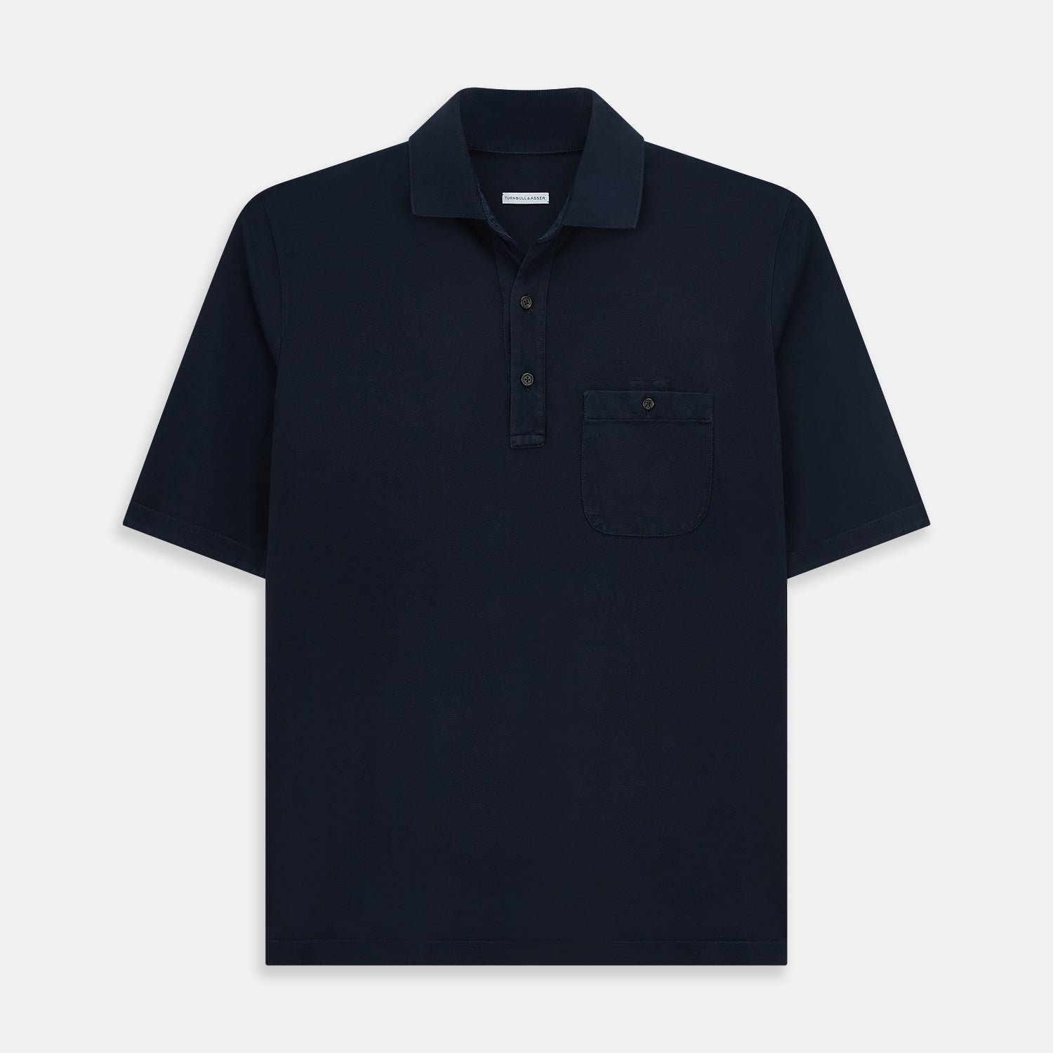 View 1 of product The Turnbull & Asser Navy Polo Shirt features short sleeves, a collar, three-button placket, and a single buttoned chest pocket, shown flat on a plain white background.