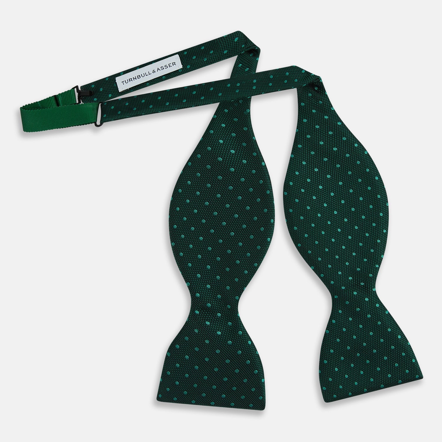 View 3 of product The Turnbull & Asser Turquoise and Forest Green Micro Dot Silk Bow Tie features small light green spots on a dark background, offering a stylish accessory for any occasion.