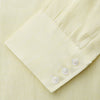 View 3 of product The Turnbull & Asser Yellow Linen Regular Fit Mayfair Shirt is a long-sleeve button-up with a collar and buttoned cuffs, shown laid flat on a white background.
