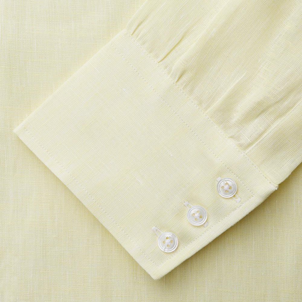 The Turnbull & Asser Yellow Linen Regular Fit Mayfair Shirt is a long-sleeve button-up with a collar and buttoned cuffs, shown laid flat on a white background.