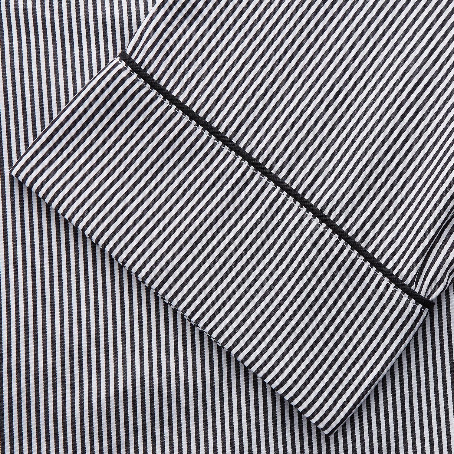 View 4 of product The Turnbull & Asser Black Candy Stripe Cotton Hyde Pyjama Set for men features soft cotton striped pajamas with a long-sleeve, button-up shirt detailed with black piping and three pockets, plus matching pants, both laid flat on a white background.
