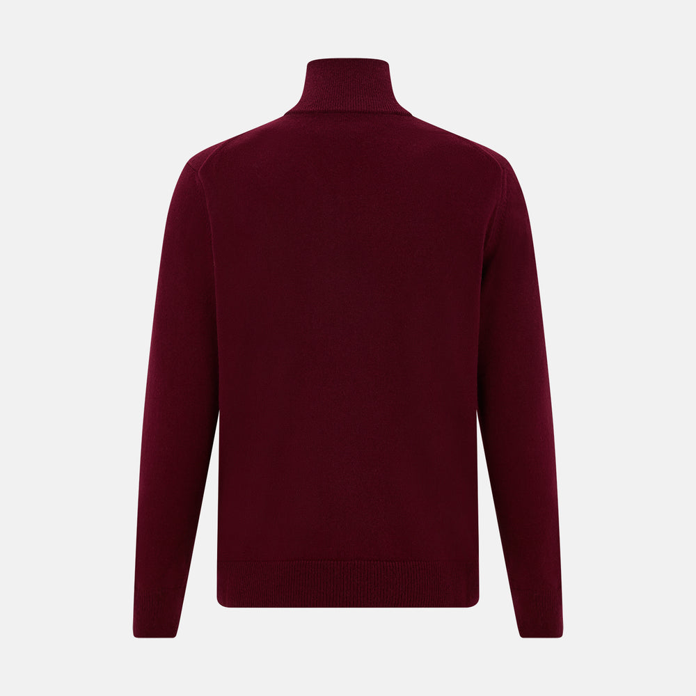 The Turnbull & Asser Ruby Red Half-Zip Cashmere Jumper, with a stand-up collar and elegant design, is displayed against a plain white background.