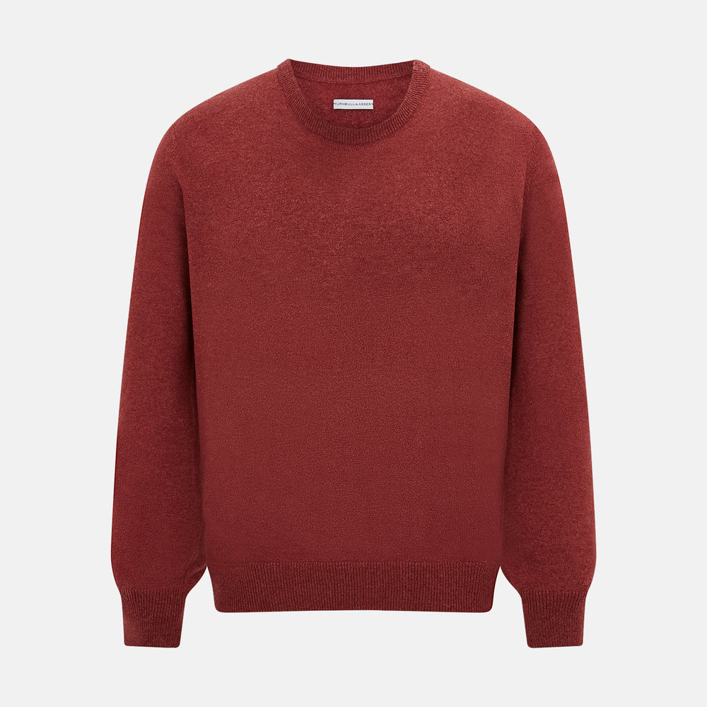 The Turnbull & Asser Crimson Red Cashmere Round Neck Jumper is a classic men’s knitwear piece, featuring long sleeves and a solid crimson hue, shown against a white background.
