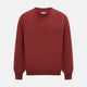 The Turnbull & Asser Crimson Red Cashmere Round Neck Jumper is a classic men’s knitwear piece, featuring long sleeves and a solid crimson hue, shown against a white background.
