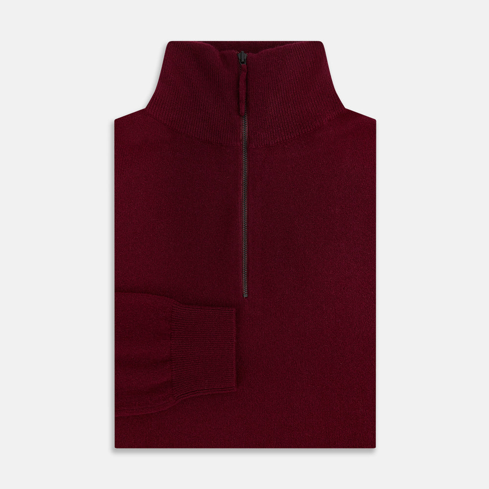 The Turnbull & Asser Ruby Red Half-Zip Cashmere Jumper, with a stand-up collar and elegant design, is displayed against a plain white background.