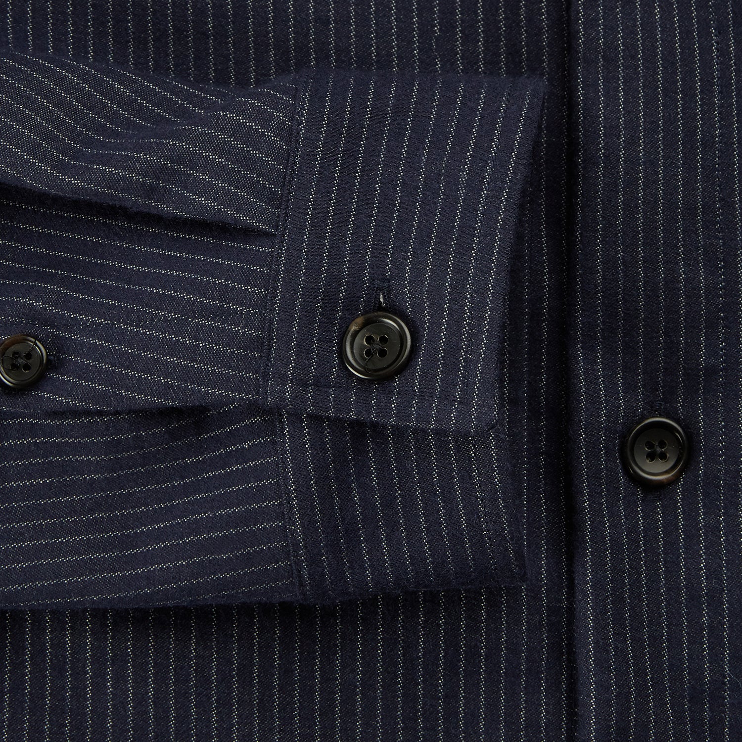 View 4 of product The Turnbull & Asser Navy Stripe Hampstead Overshirt features pinstripes, a collar, long sleeves, chest pocket, and two angled side pockets—ideal for refining your formal look. Shown laid flat on a light background.