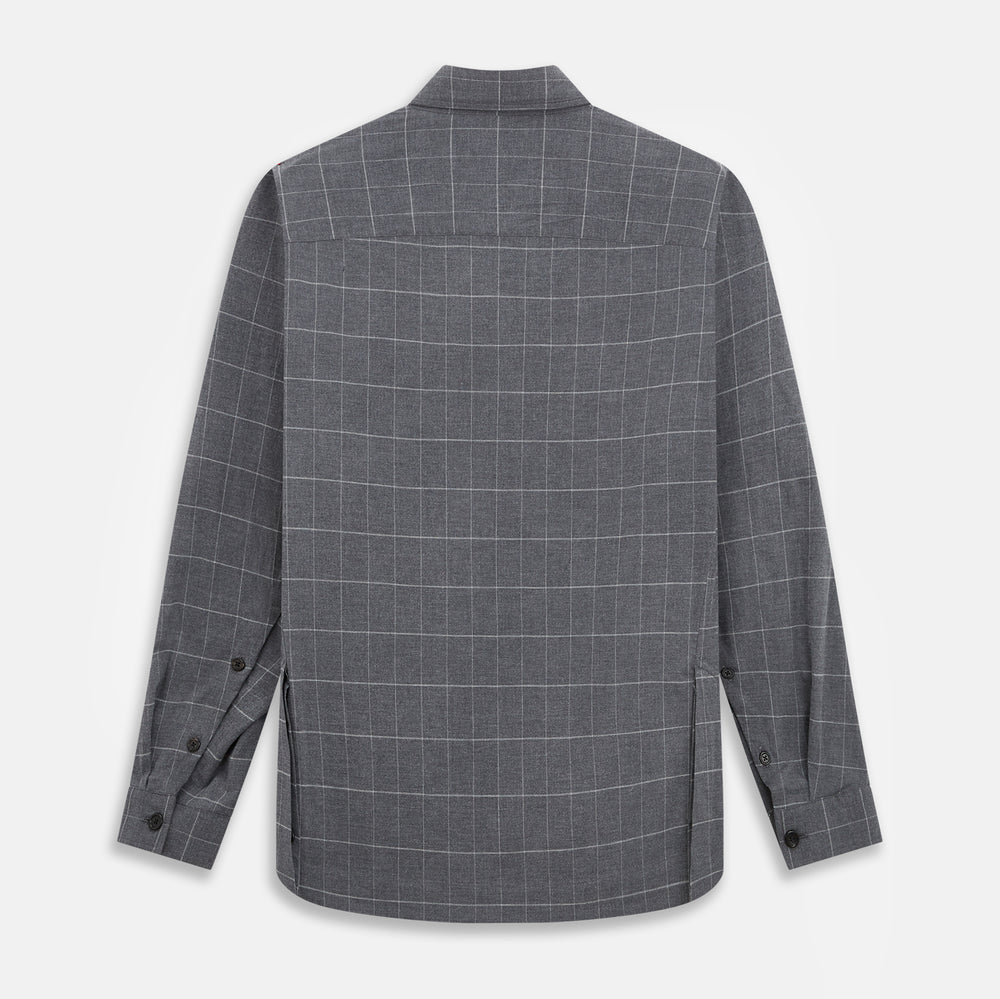 The Turnbull & Asser Charcoal Melange Check Hampstead overshirt, a long-sleeve button-up with a collar and two zippered side pockets, is laid flat on a light gray background.