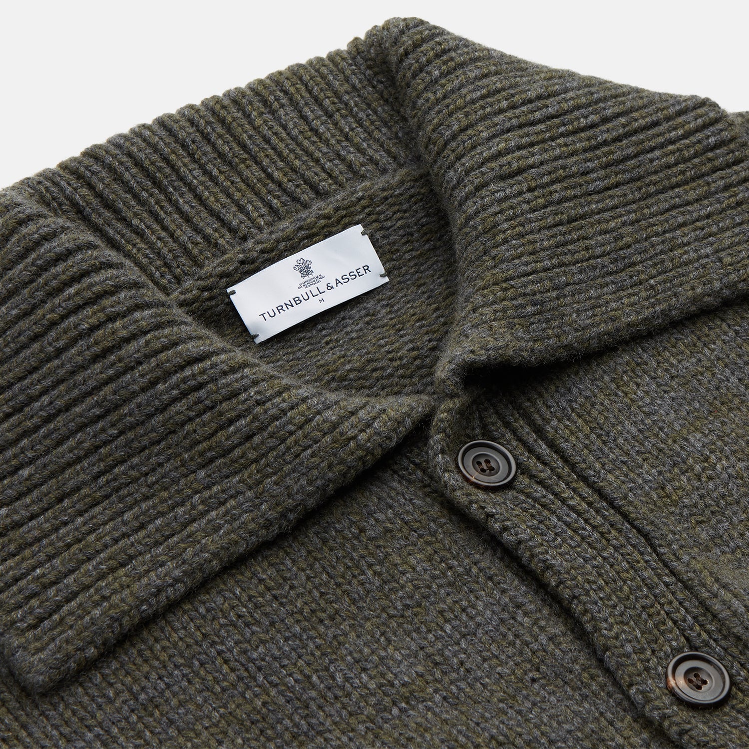 View 2 of product The Turnbull & Asser Green and Grey Cashmere Melange Lowry Cardigan is a long-sleeve piece with a revere collar, button-up front, and ribbed cuffs and hem, shown laid flat on a white background.
