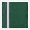View 3 of product The Forest Green and Lilac Stripe Silk Pocket Square by Turnbull & Asser features thin white pinstripes, a bold light purple vertical stripe, and a visible branded label for classic British elegance. One corner is neatly folded over.