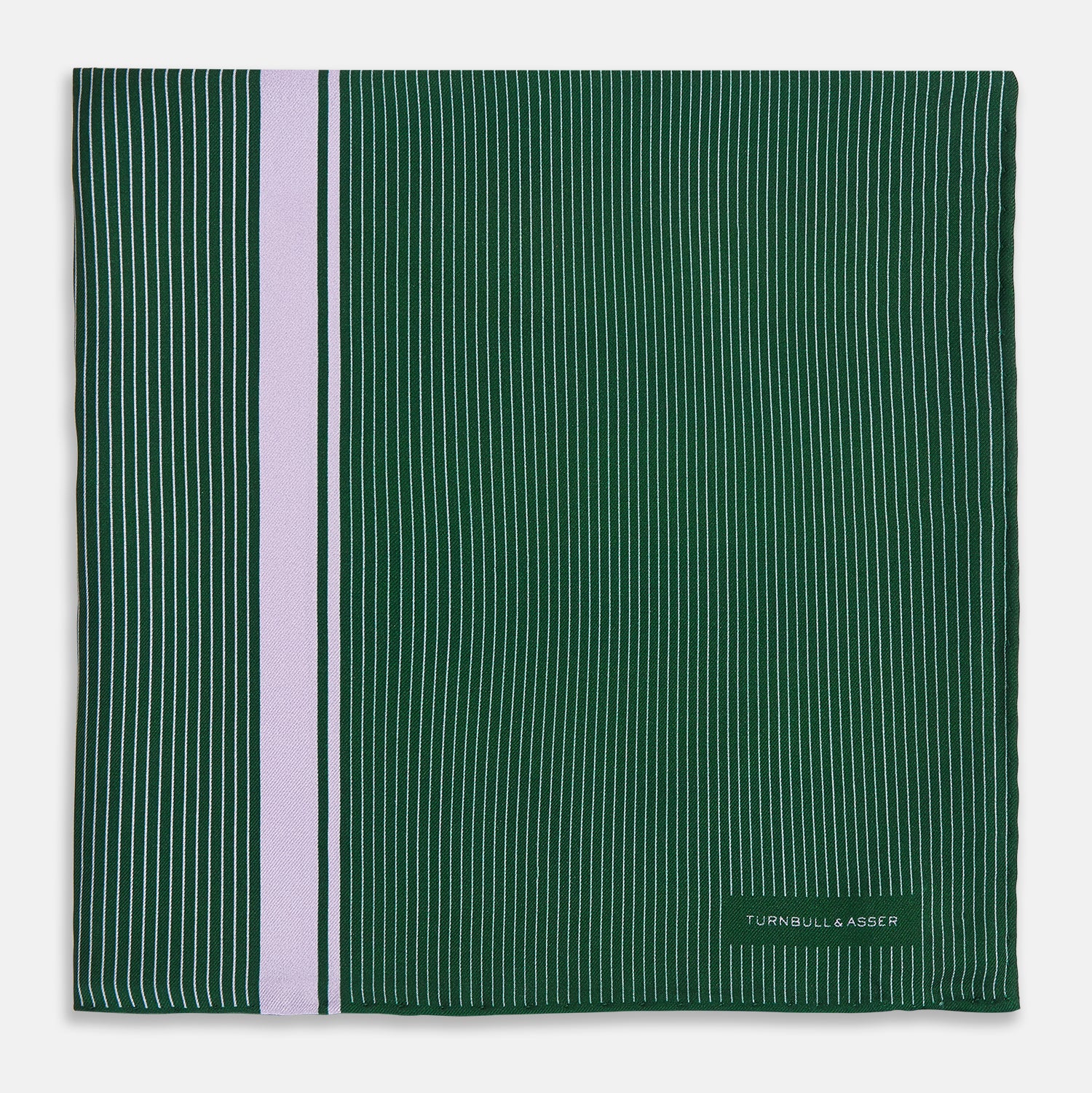 View 3 of product The Forest Green and Lilac Stripe Silk Pocket Square by Turnbull & Asser features thin white pinstripes, a bold light purple vertical stripe, and a visible branded label for classic British elegance. One corner is neatly folded over.