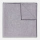 The Lilac Cotton-Blend Handkerchief by Turnbull & Asser is neatly folded with a corner flipped over, exposing the hand-rolled edges, and displayed against a white background.