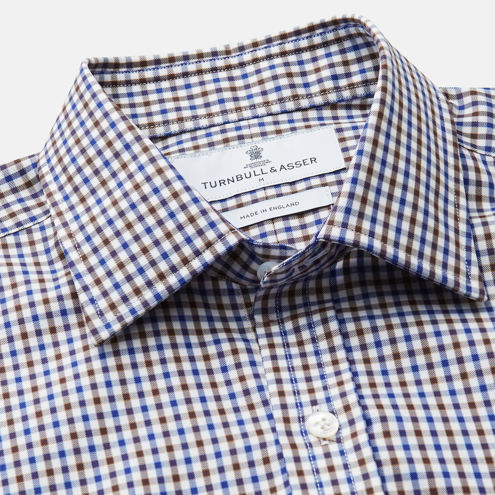 A must-have for any men's wardrobe, the Turnbull & Asser Brown and Blue Cotton Multi Check Weekend Fit Finch Shirt features long sleeves, button-down design, collar, and buttoned cuffs in a stylish check pattern.