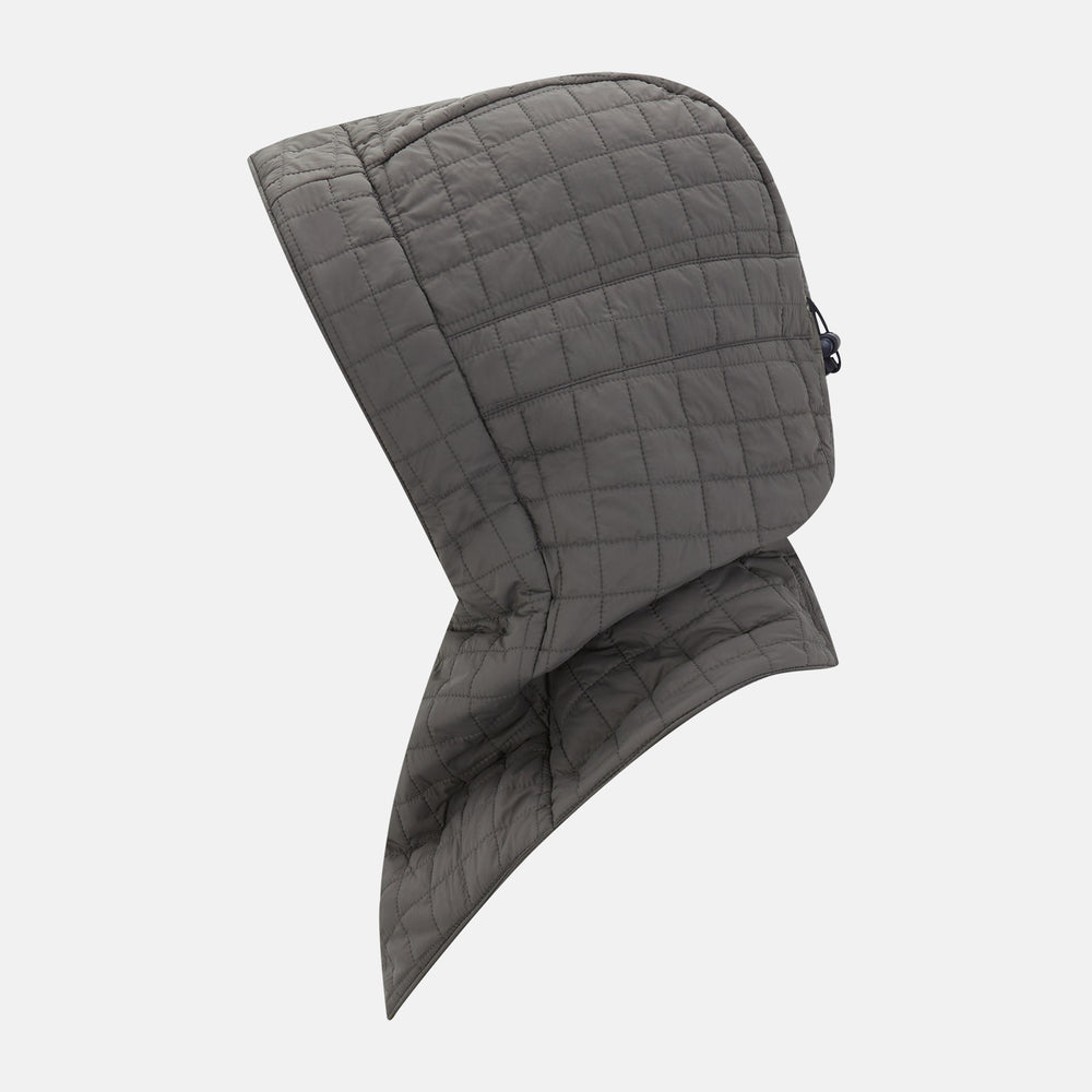 The Turnbull & Asser Shadow Grey Quilted Hood with Neck Warmer features a button closure, inspired by quilted jacket hoods, and is displayed on a plain white background.